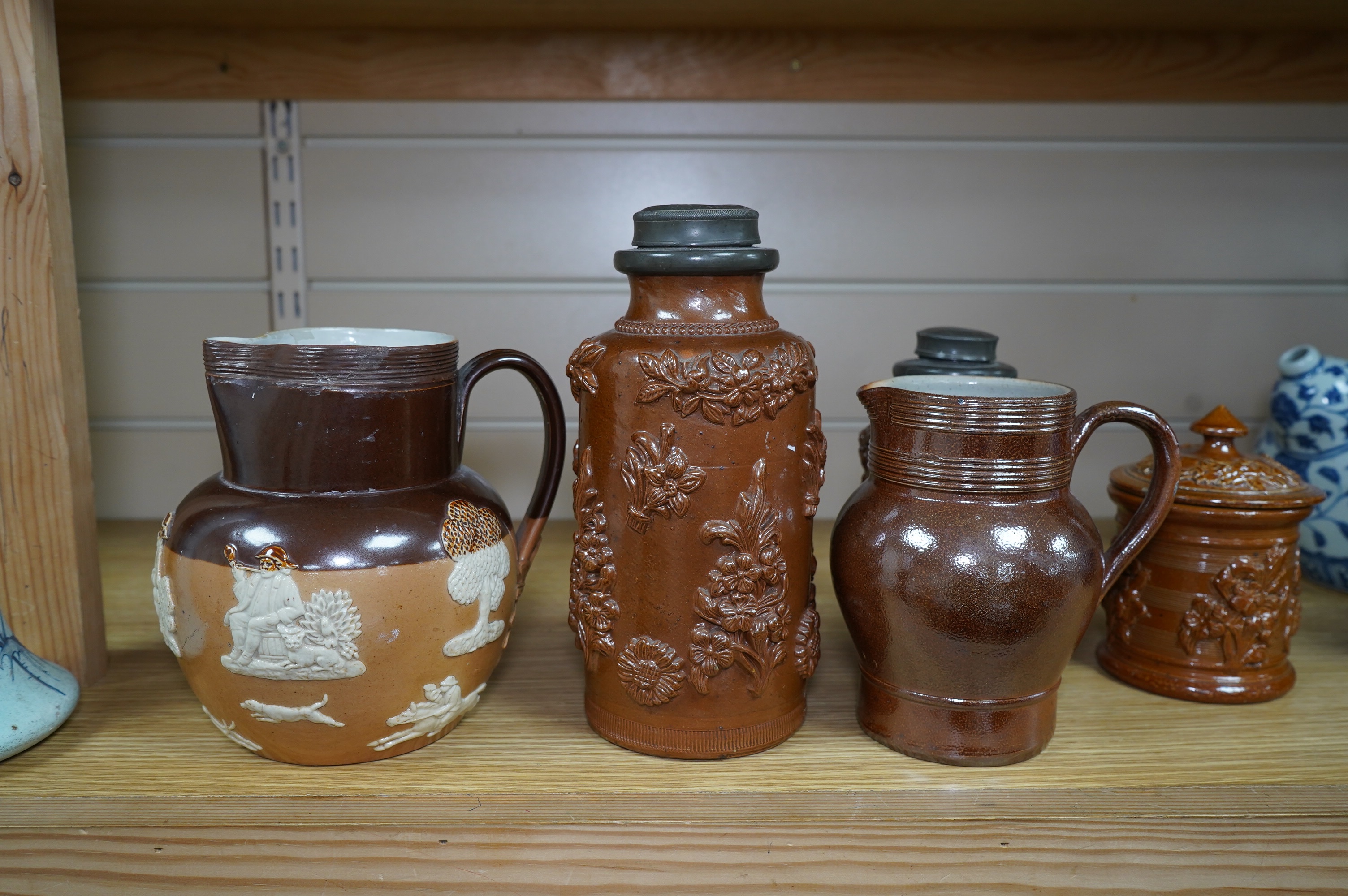 Four 19th century Derbyshire lead glazed stoneware jars and a stoneware jug and another, tallest 21cm (6). Condition - poor to fair